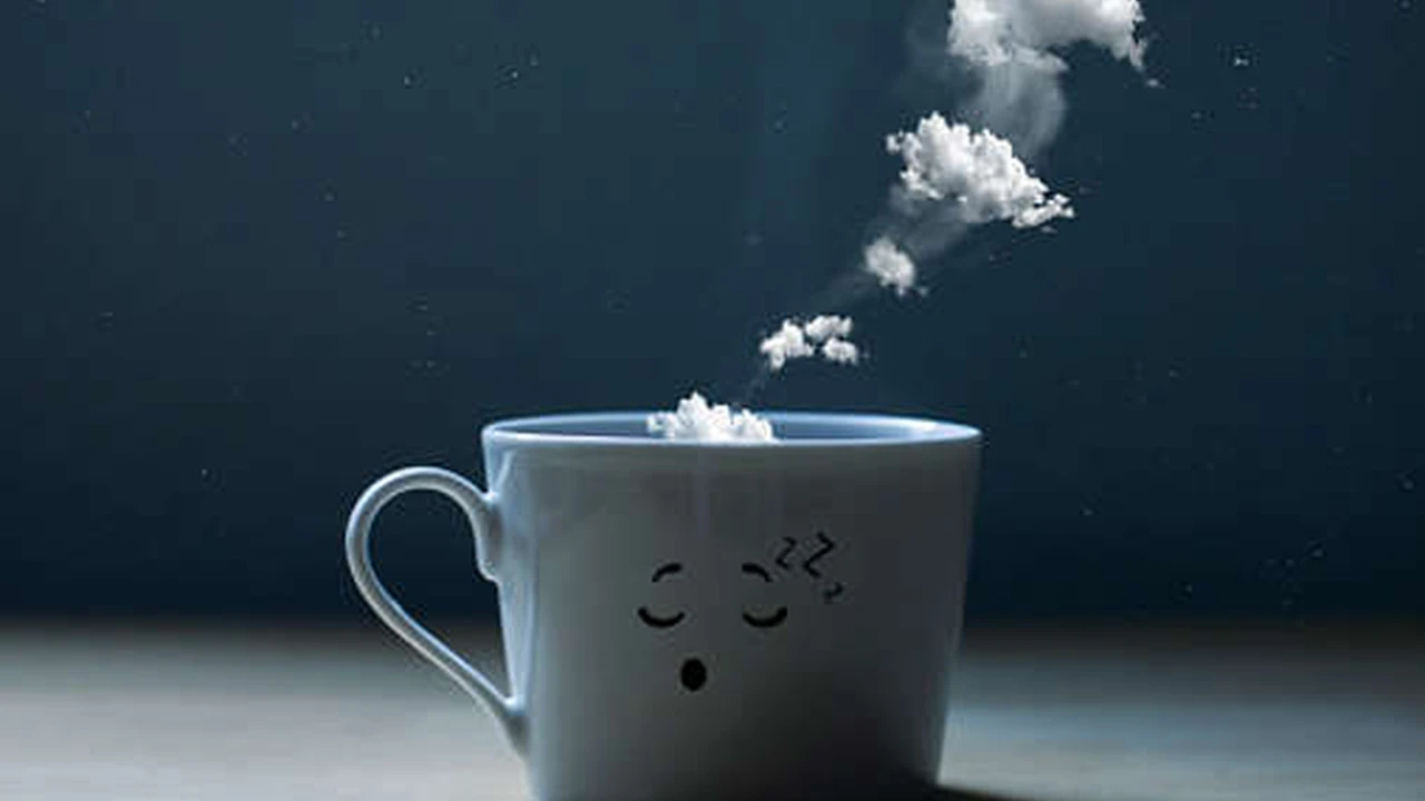 overhead view of corned beef sliced and on a platter with cabbage, potatoes, and carrots